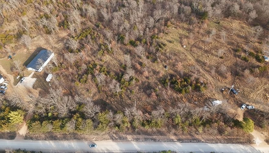 Discover your ideal 4-acre canvas for country living in the scenic Ozark foothills of Lincoln, Arkansas. This professionally surveyed parcel offers peaceful seclusion with convenient access, situated along Little Road in desirable Washington County. The gently rolling terrain provides excellent build site potential with established building setbacks already defined. Enjoy the best of Northwest Arkansas living with Fayetteville and the University of Arkansas just 25 minutes away, while world-class attractions like Crystal Bridges Museum, Devil's Den State Park, and the historic Prairie Grove Battlefield are all within easy reach. Lincoln's charming small-town atmosphere features quality schools, the annual Apple Festival, and proximity to NWA's thriving job market and amenities. Agricultural zoning allows flexibility for your homestead dreams. Whether you're building your forever home, seeking a weekend retreat, or investing in NWA's growth corridor, this acreage delivers location, privacy, and potential.