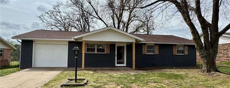 Impossible Find! This beautifully remodeled gem in Rogers offers the modern finishes you crave at an incredible value. Nestled on a spacious level lot in the heart of Rogers, this 1,160 sq ft home has been transformed into a sleek, turn-key retreat. Step inside to discover bright, open-concept living accented by contemporary flooring and a fresh, neutral palette. The kitchen is a showstopper, featuring clean lines, updated cabinetry, and ample prep space—perfect for the home chef. With 3 bedrooms and 1.5 baths, the layout is designed for comfort and efficiency. Enjoy your morning coffee on the patio overlooking the expansive backyard, a blank canvas ready for your garden or outdoor entertaining. Located just minutes from the vibrant shopping at Pinnacle and the charm of downtown Rogers, this home delivers the perfect balance of seclusion and convenience. Don't let this rare opportunity pass you by. View the virtual tour today and then schedule your in-person showing! (Offers due by 4pm 4/13)