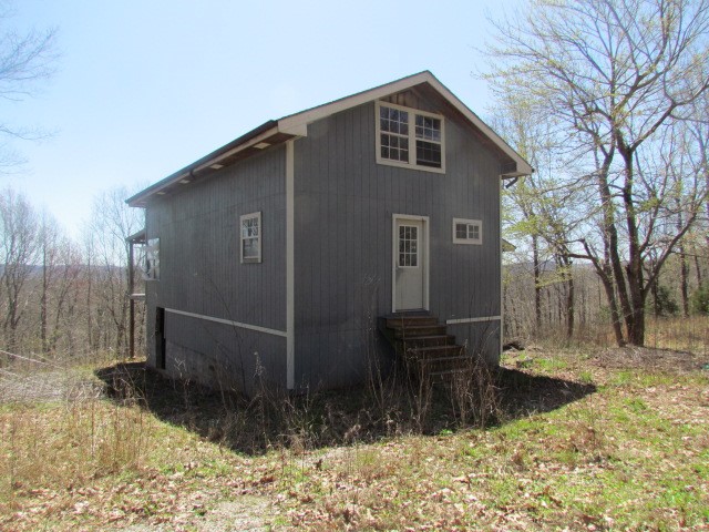 House on 6.4 Acres is unfinished & needs work. Please look at pictures. It can be bought "as is" or we will finish. Price is "as is". Price will go up as we do work! Can be bought with additional 8.8 acres. See MLS 6069. Agent owned