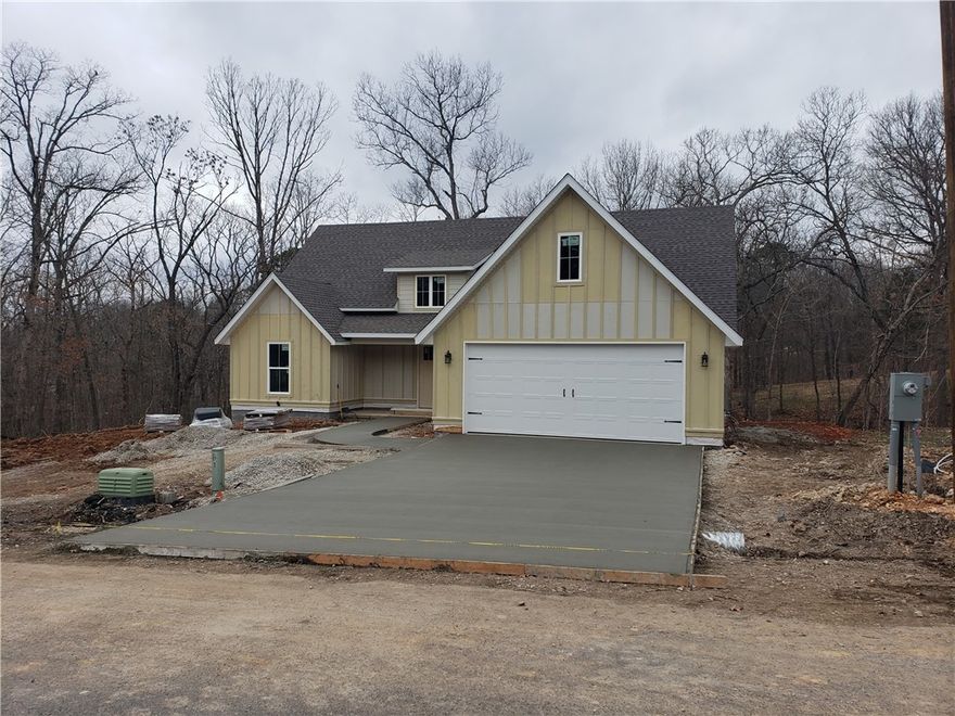Beautiful new construction on .30 acre lot with a large covered deck on the back. Home features stainless steel appliances, laundry room with sink, wood flooring in family room, hall and master, walk in closets, pantry and more! Schedule your showing today!