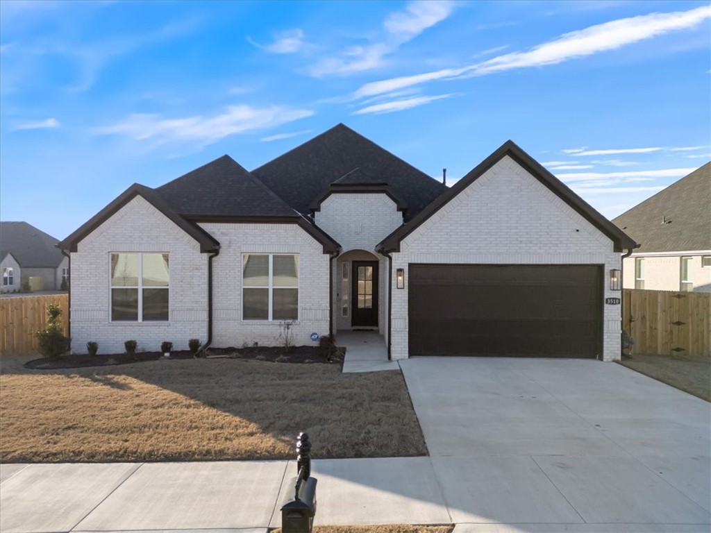 You do not want to miss this like-new, all-brick home located near The Botanical Gardens, the Razorback Greenway, Fayetteville Athletic Club, shopping, and restaurants. Beautiful 4 bedroom, 3 bathroom home is move-in ready and sits on one of the premium corner lots in the neighborhood. The yard is fully fenced and has a covered patio to enjoy your backyard. The open concept floor plan has an oversized kitchen island, quartz countertops with eat-in kitchen. The living room has gas fireplace, 2-inch blinds throughout, tankless water heater, and wood laminate flooring. All bathrooms have double sinks and primary bath has soaking tub with walk-in shower. Taxes are still TBD since the home was recently built.