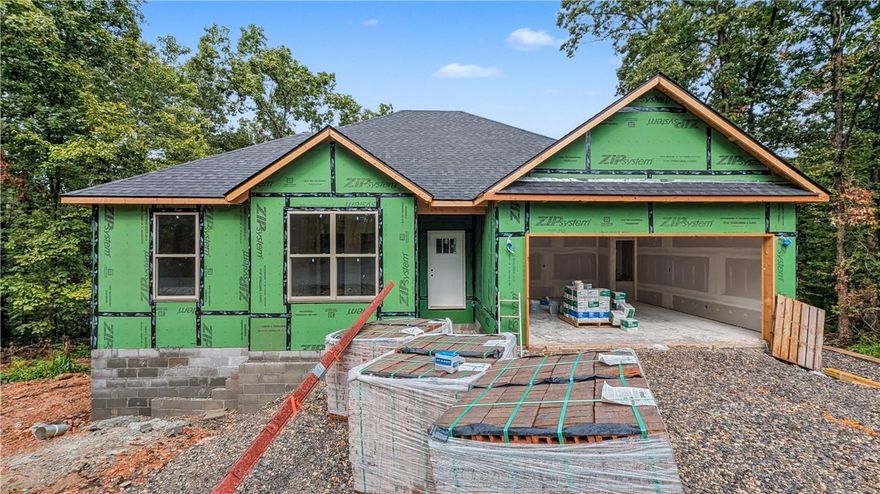 Welcome To Your Next Home! Picture It — A Fresh New Build With A Classic Brick Front, 3 Bedrooms, A Smart Split Floorplan, And 9-Foot Ceilings That Make Every Space Feel Bright And Open. The Living Room Steals The Show With A Vaulted Ceiling (Optional Beams For That Extra Drama), Flowing Seamlessly Into A Kitchen That’s As Functional As It Is Stunning — Upgraded Cabinets To The Ceiling, Granite Counters, Tile Backsplash, Island With Bar Seating, Pantry, And A Spacious Dining Area Ready For Memorable Gatherings. The Primary Suite Feels Like A True Retreat With A Dual Vanity, Full Custom Tile Shower With A Tile Floor And Surround, And A Walk-In Closet That Cleverly Passes Through To The Laundry/Utility Room For The Ultimate Convenience. Thoughtful Storage Is Tucked Throughout, And Out Back You’ll Find A Covered Deck Overlooking A Freshly Sodded Yard And Peaceful Views — The Perfect Spot For Morning Coffee Or Evening Cocktails. Super Fab Private Location - Currently The Only House On The Street! Contract And Customize
