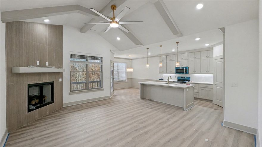 Rates As Low As 4.875%. Welcome To Your Next Home! Picture It — A Fresh New Build With A Classic Brick Front, 3 Bedrooms, A Smart Split Floorplan, And 9-Foot Ceilings That Make Every Space Feel Bright And Open. The Living Room Steals The Show With A Vaulted Ceiling With Beams For That Extra Drama, Flowing Seamlessly Into A Kitchen That’s As Functional As It Is Stunning — Upgraded Cabinets To The Ceiling, Quartz Counters, Tile Backsplash, Island With Bar Seating, Pantry, And A Spacious Dining Area Ready For Memorable Gatherings. The Primary Suite Feels Like A True Retreat With A Dual Vanity, Full Custom Tile Shower With A Tile Floor And Surround, And A Walk-In Closet That Cleverly Passes Through To The Laundry/Utility Room For The Ultimate Convenience. Thoughtful Storage Is Tucked Throughout, And Out Back You’ll Find A Covered Deck Overlooking A Freshly Sodded Yard And Peaceful Views — The Perfect Spot For Morning Coffee Or Evening Cocktails. Super Fab Private Location - Currently The Only House On The Street!