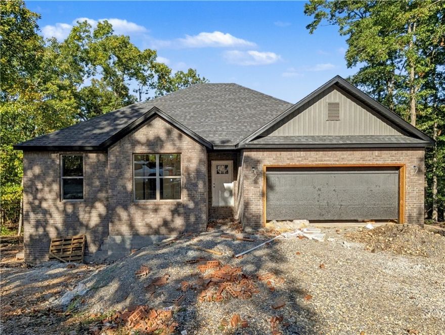 Welcome To Your Next Home! Picture It — A Fresh New Build With A Classic Brick Front, 3 Bedrooms, A Smart Split Floorplan, And 9-Foot Ceilings That Make Every Space Feel Bright And Open. The Living Room Steals The Show With A Vaulted Ceiling (Optional Beams For That Extra Drama), Flowing Seamlessly Into A Kitchen That’s As Functional As It Is Stunning — Upgraded Cabinets To The Ceiling, Granite Counters, Tile Backsplash, Island With Bar Seating, Pantry, And A Spacious Dining Area Ready For Memorable Gatherings. The Primary Suite Feels Like A True Retreat With A Dual Vanity, Full Custom Tile Shower With A Tile Floor And Surround, And A Walk-In Closet That Cleverly Passes Through To The Laundry/Utility Room For The Ultimate Convenience. Thoughtful Storage Is Tucked Throughout, And Out Back You’ll Find A Covered Deck Overlooking A Freshly Sodded Yard And Peaceful Views — The Perfect Spot For Morning Coffee Or Evening Cocktails. Super Fab Private Location - Currently The Only House On The Street! Contract And Customize
