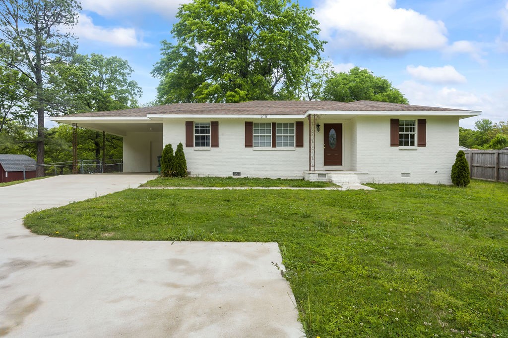 Spacious corner property next to open land. Two lots totaling over half an acre. Recently updated, cute house with all hard surface floors (real wood and LVP). Newer stainless steel appliances and fixtures. Super clean and move in ready. Newer roof. Extra storage off the carport. Huge backyard and storage building.