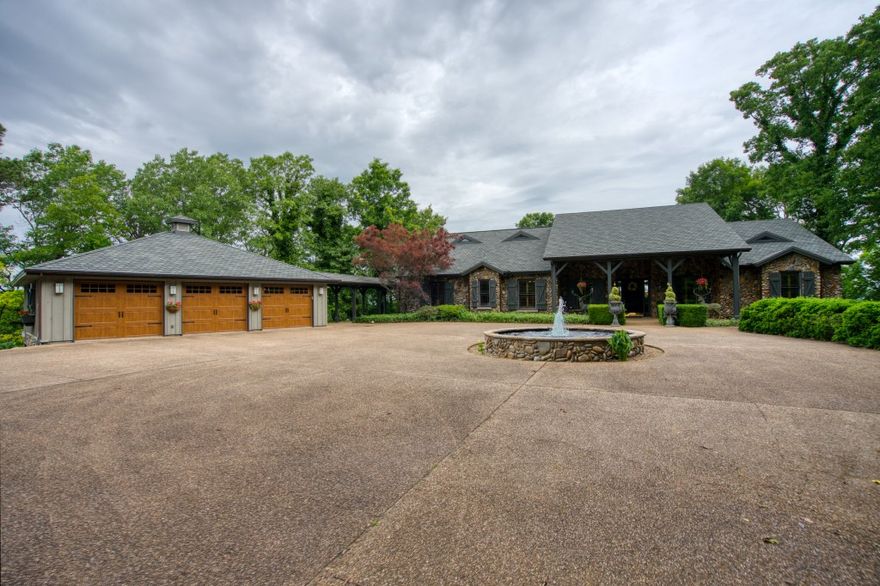 Truly a one of a kind Beaver Lake home! Property is located a half mile behind Beaver Dam, giving you an amazing view of the White River, Beaver Lake, and the back of the dam! No other privately owned location on this lake gets you so close to this rare view! Watch boats on the lake, fishermen on the river, view sunsets, and experience the sight AND sound of water coming through the dam floodgates and into the White River! Custom features including intricate custom cabinets, moldings, and ceilings, plantation shutters throughout, oversized doors and high ceilings, expansive outdoor entertainment area, sauna and laundry adjoining the master suite, hidden walk-in kitchen pantry, custom rock work on the entire exterior, 3 car garage with storage, and more (see attached feature sheet)! Half mile paved private drive and large gated entry way. Marina boat slip included! Adjoins the Corps of Engineers take-line so you can hike to lake or river on government land. Boat ramps on the river and lake less than 5 minutes away!