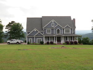 Beautiful BLUFF View of the Galla Creek Lake from the private balcony of your master suite! This impressive home boasts 6,000 square feet including 6 bedrooms, home office, 2 laundry areas and a chef worthy kitchen. Relax in the 17 foot Swim Spa situated on the sprawling 2.75 acres. Call today to schedule your very own private showing!
