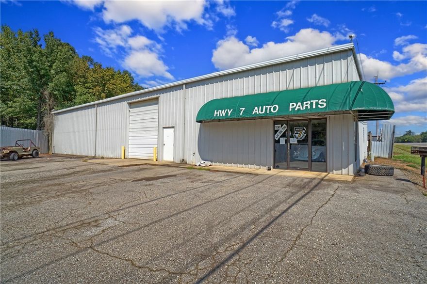 Ideal for Redevelopment or Auto Business, this 5.94-acre property offers a unique opportunity for investors and business owners. Formerly an auto parts and salvage yard, the property features a large metal building with heated and cooled office space, overhead doors, and ample shop workspace. A second shop building and tall perimeter metal fencing offer added functionality and security. This prime location provides excellent visibility and accessibility for a wide range of commercial or industrial ventures.