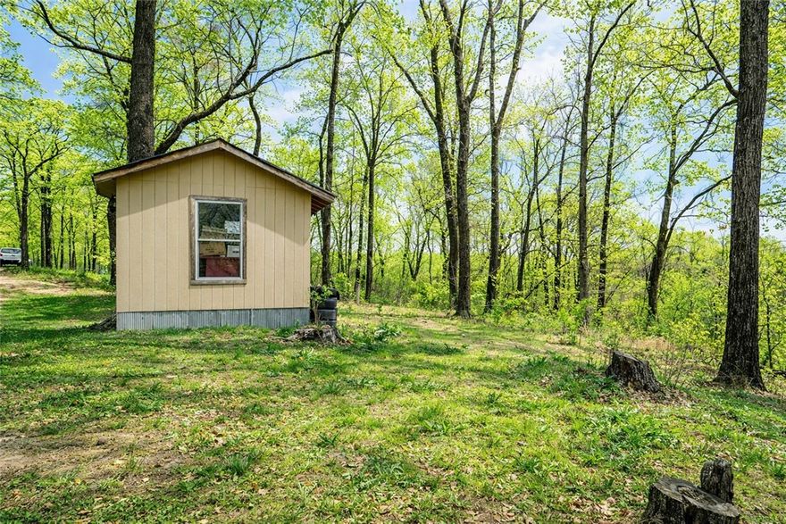 Private acreage, move-in ready home, and future build potential — all in one incredible property!
Follow the winding gravel drive through the trees to a peaceful setting where a charming 3 bedroom, 2 full bath home is perfectly positioned to take in the beauty of the surrounding land. With a blend of open clearings and mature hardwoods, this property offers the privacy and quiet so many buyers are searching for.
A second cleared homesite is already in place and ready for your vision — with room to build up to a 4 bedroom, 3 bath home. The infrastructure is here to make it happen: electric has already been run most of the way to the new build location, and the large, high-producing well is sized to comfortably serve both homes, giving you flexibility for multi-generational living, a guest house, or future investment potential.
Bring your RV and start enjoying the property immediately with the on-site RV hookup, perfect for visitors, weekend stays, or while you build.