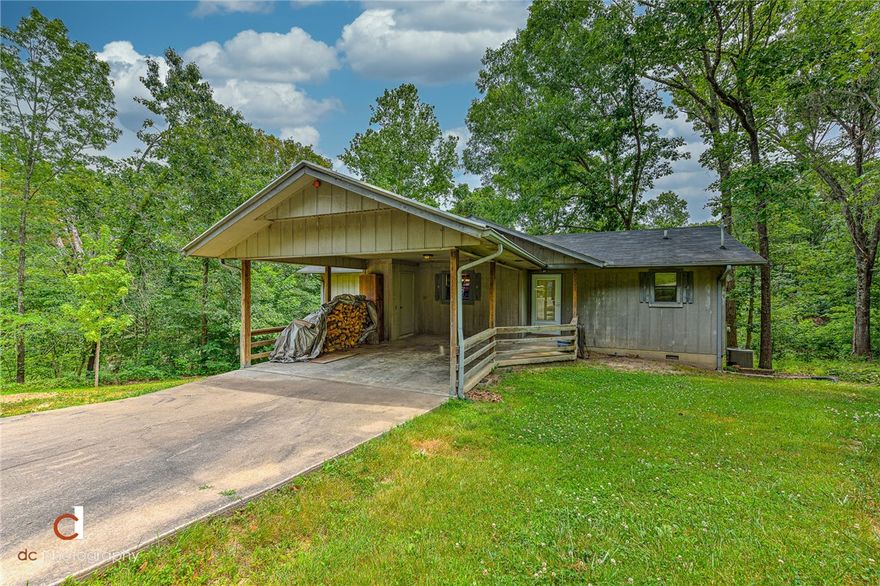 Country living at its best in the city with this secluded home surrounded by mature trees and minutes from Lake Loch Lomond.  This home has all the privacy you could want and is situated within a gourmet mushroom hunter's paradise! All appliances convey and the water heater and plumbing have been replaced this year. New HVAC and wood burning fireplace in 2013.  Let the inside of the home be your blank canvas and transform it into the home of your dreams. This property is perfect for investors, first time home buyers, or empty nesters looking to downsize and want privacy but still close to community amenities and local shopping. Huge crawlspace could be converted to a workshop or an additional walkout basement living space. The potential is unlimited!!! Minutes from Lake Loch Lomond Marina, Scotsdale Golf Course and Branchwood Recreation Center. This one won't last long!