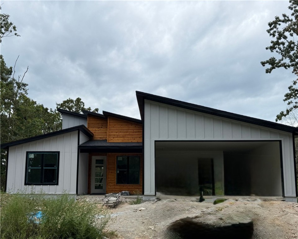 Beautiful contemporary new construction on a flat lot! This 2-bed, 2.5-bath home features an eat-in kitchen with waterfall island, one-piece backsplash, gas range with blower vent, a hidden walk-in pantry, and an office. No carpet—just tile and premium LVP throughout. Built with Zip System sheathing and Solar Board roofing to keep the home energy-efficient and the attic up to 40° cooler in Summer.