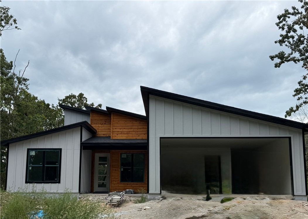 Beautiful contemporary new construction on a flat lot! This 2-bed, 2.5-bath home features an eat-in kitchen with waterfall island, one-piece backsplash, electric range, a hidden walk-in pantry, and an office. No carpetājust tile and premium LVP throughout. Built with Zip System sheathing and Solar Board roofing to keep the home energy-efficient and the attic up to 40° cooler in Summer.
