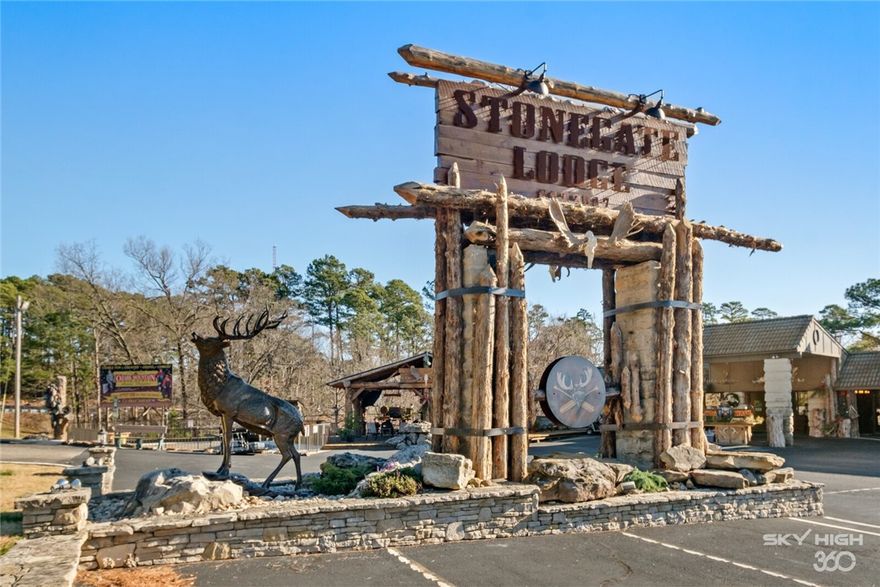 This is your chance to capture an established & booming boutique lodge situated on over 2 AC of prime commercial space with high visibility & over 245’ of Major Road Frontage on the busiest road in Eureka Springs! Nestled in the heart of the Ozarks, The Stonegate Lodge is a meticulously maintained, turnkey property boasting 34 tastefully decorated, well apportioned rooms, completely upgraded in 2021 & prime location for guests to experience all that Eureka Springs has to offer! From the spectacular monument sign, to the stunning limestone exterior, the inviting feeling of this property can’t be overstated! Inside this gem is a welcoming reception & retail area, private manager’s quarters, owner’s suite, maids room, & commercial laundry facility! The epicenter of this location is an expansive outdoor entertaining area, featuring a stacked stone fireplace, fire pits, huge HD TV, & saltwater pool! The spacious parking lot features plenty of room for hosting events, a motorcycle wash station, & convenient trolley stop!