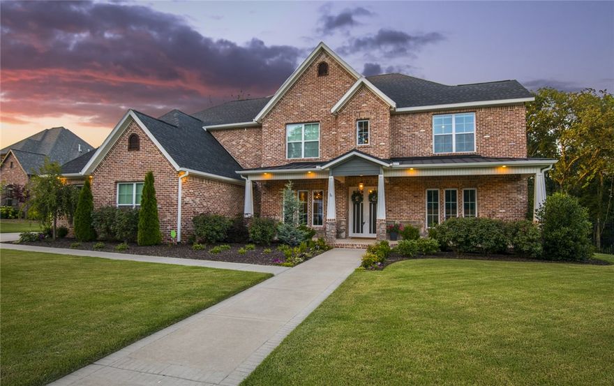 Wrapped in reclaimed brick from historic Busch stadium, details set this home apart from the moment you walk through the custom wrought iron French doors onto the European white Oak floors & look up to see wood inlaid ceilings in the entry & dining room. Another custom door greets you at the office/music room, but you may be enticed to work from the large marble kitchen island instead. This open kitchen is an entertainer's dream with its like-new 48in gas range with double ovens & ample  counterspace for baking days. Treat guests to a gourmet coffee from the Italian Espresso maker & enjoy how simple it is to serve beautiful meals on the hand built buffet. Get off your feet and unwind in front of one of three gas fireplaces or take a deep soak in the master tub, then gaze out the windows or at the stunning vaulted ceilings as you drift off to sleep in the master. There are more memories to be made around the wood burning firepit overlooking the firefly flecked woods or in the comfort of the sound proofed media room.