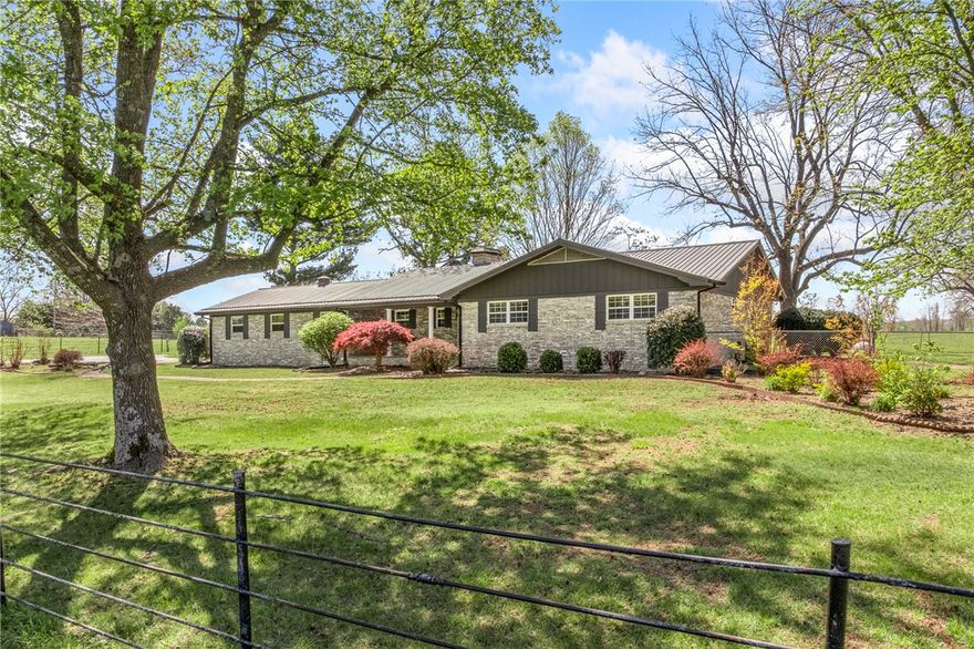 House, land, paved access—and located in the Valley Springs School District. It’s hard to find a place like this with the improvements already in place for you. Approx. 60 acres in Harrison with Highway 62 frontage, featuring highly usable ground, an approximately 1-acre pond, and a barn that’s set up to actually function. From the moment you turn in, the paved access and tree-lined drive set the tone. The land lays great- open, clean, and easy to use whether you’re running livestock, keeping horses, or just want space that works for you. The barn is a standout. Horse stalls with automatic waterers, a tack room, and working pens all under roof make day-to-day use simple and efficient. It’s the kind of setup you appreciate more the longer you own it. The home offers 2,184 sq ft with an additional 575 sq ft of semi-finished basement space, along with a metal roof and fenced in backyard. If you’ve been waiting on something where the improvements are already done… this is the one you don't want to miss.
