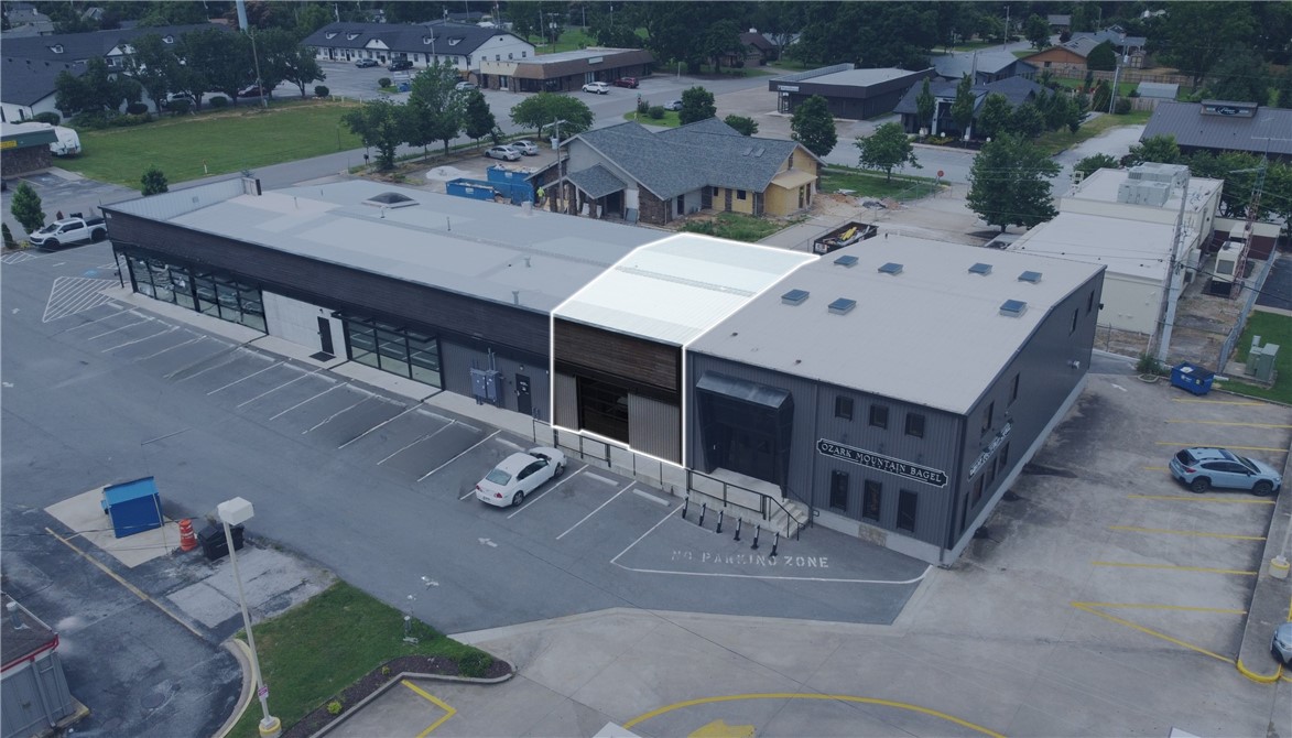Sublease opportunity featuring an open floor plan, two private offices, two restrooms, and a custom kitchenette. Furniture is not included.