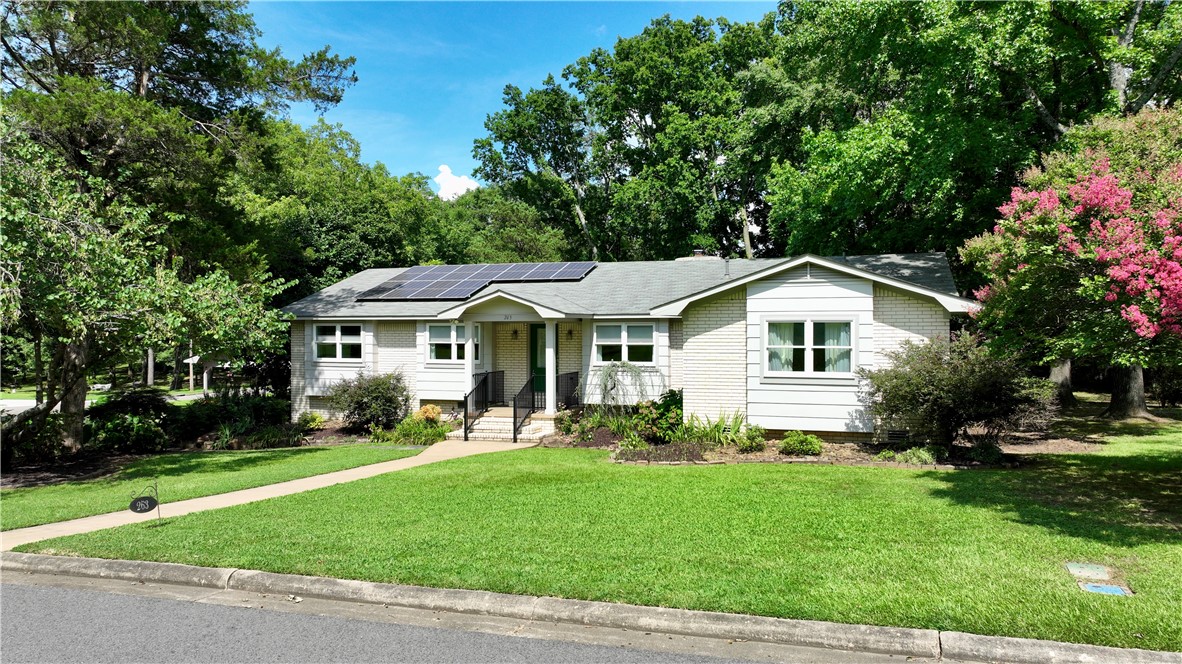263 S Enid is located in the pleasant west side neighborhood of Pinewood and has been well-maintained just as the surrounding properties have been for many years. If you have lived in Russellville a long time or are new arrivals, you will quickly find that this area is a great location and a good investment for the future. Here are a few things done by the owner that demonstrates how the property has been maintained. In 2012: sunroom and safe room were added for pleasure and security. In 2020: fireplace brick & box inspected & repaired, new chimney cap installed and sealed. In 2021-2022: new roof installed and solar panels(all paid off) put in place to reduce electric bills that routinely average less than $30 per month. In 2024: all exterior was painted. 2025: all composite decking has been pressure washed, landscaping has fresh mulch. Two hot water heaters make it easy for a busy household to keep up with the demand. So much more could be said, but it is better for you to see in person, so schedule today!