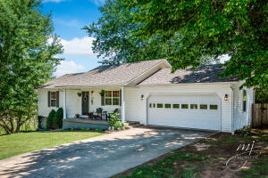 GORGEOUS CONTEMPORARY/MODERN HOME IN FANTASTIC NEIGHBORHOOD ON NORTH EDGE OF HARRISON! 4BR/2BA home w/ almost 2100 sq. ft. w/ TONS of updates! BEAUTIFUL hardwood floors, Immaculate Quartz counter-tops, Subway tile back-splash, Schoolhouse lighting fixtures & Master Walk-In Closet w/ custom built-ins. Full, Finished, Walkout basement. Situated on a corner lot with oversized lot and away from other homes in the neighborhood. Relaxing private backyard & patio w/ fire-pit perfect for entertaining!