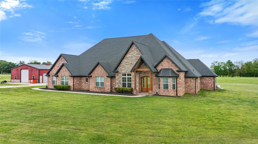 Discover this exquisite 4,693 sq. ft., 4-bedroom, 4.5-bathroom estate home set on 20 lush acres. This two-story gem offers a perfect blend of luxury and functionality. The expansive open entertainment area features a projection screen and a massive game room, ideal for hosting gatherings. The open kitchen, with granite and hardwood, seamlessly flows into the living room, complete with a cozy gas fireplace, creating a warm and inviting atmosphere. Step outside to the covered porch and entertainment area, where you'll find an in-ground saltwater pool, perfect for relaxation and outdoor fun. The master suite is a true retreat, boasting an oversized walk-in, dual entrance closet, and an open floor plan master bath designed for ultimate comfort. The property is adorned with lush grass, providing a serene and picturesque setting. Additionally, a large 60 x 40 insulated shop with electric and three overhead doors offers ample space for projects and storage. This gorgeous estate offers a unique blend of elegance.