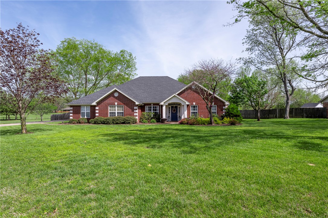 Welcome to your custom-designed family retreat. 5-bedroom, 3-bathroom in Rogers! This .81-acre property boasts standout features inside and out. Step into a meticulously crafted interior with built-in details throughout, including an updated kitchen and baths with granite countertops. Outside, enjoy your own private oasis with a sparkling pool and covered back patio, perfect for summer gatherings. A detached garage offers ample storage space. Located in an upscale cul-de-sac neighborhood, enjoy peace and quiet while still being moments away from shopping, dining, and outdoor adventures. Recent updates ensure modern comfort and style, making this home perfect for family living. With its large lot and prime location, don't miss the chance to experience luxury living in Rogers.