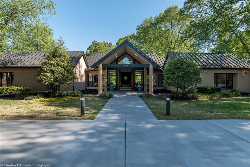 Exceptional, one owner, custom built home designed by Steve Miller. Exceptional views! Located on 2.83 acres with views of Lake Fayetteville. Accentuated by floor to ceiling glass windows allowing ample natural light and visual access to pool and landscape. Close to Lake, bike Trails, Park, Country Club, shopping and more. The envy of every property in this price category.