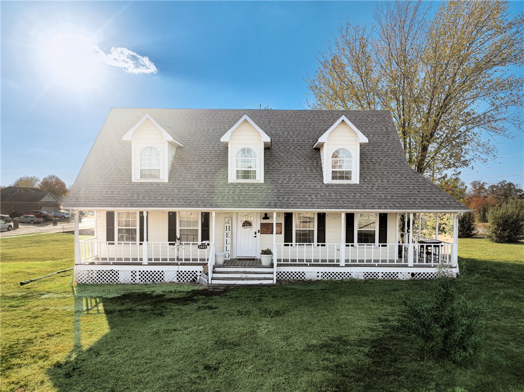 Seller offering $5,000 in concessions! Discover the perfect blend of country charm & modern comfort in this beautifully remodeled farmhouse, nestled on a spacious 1.31-acre corner lot. Enjoy serene country living while remaining just minutes away from essential amenities. Step onto the inviting wrap-around porch, ideal for morning coffee or evening gatherings. Inside, you'll find a thoughtfully updated interior featuring new flooring (2023) & stylish granite countertops that enhance the farmhouse aesthetic. Key features include a new water heater (2021), an outdoor shed with electric, & a layout designed for both functionality & comfort. With ample outdoor space, this property is perfect for gardening, entertaining, or simply enjoying the tranquility of rural life. Don’t miss your chance to own this unique farmhouse gem in Pea Ridge!