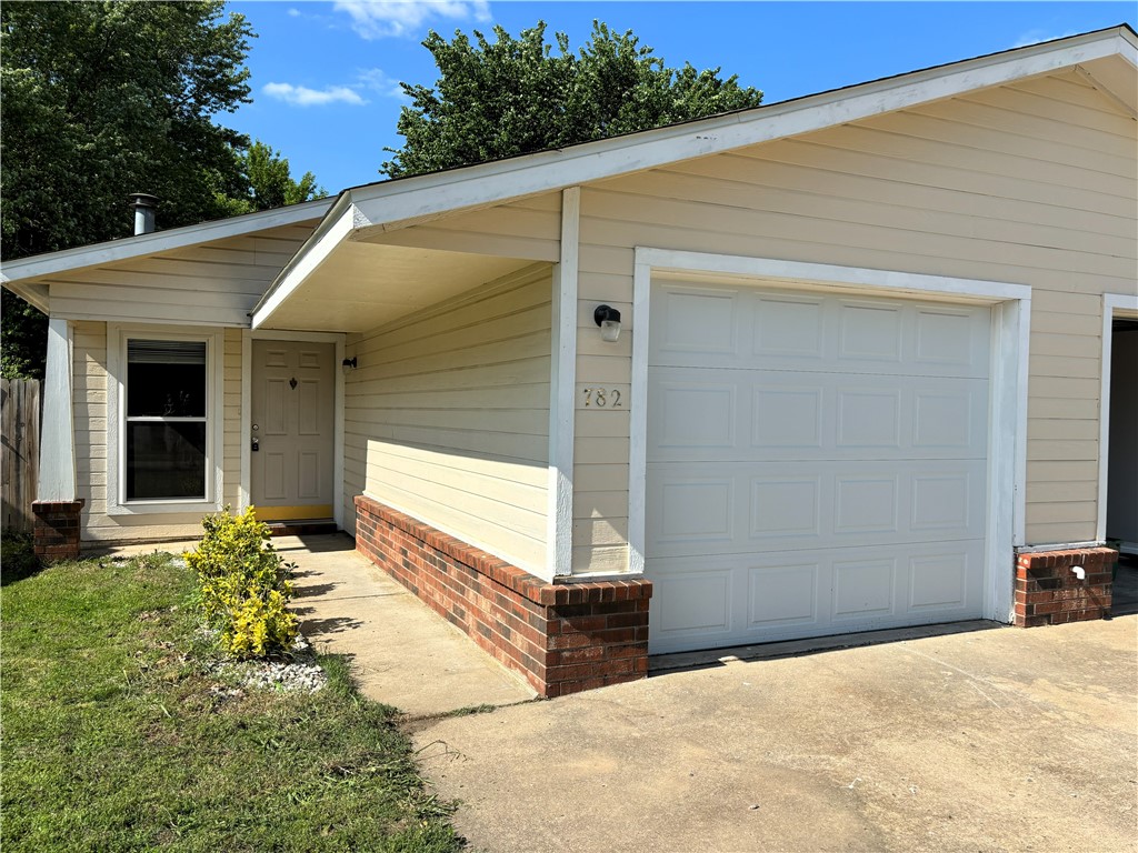 Attention investors and/or parents sending your recent graduates to The University of Arkansas and wanting a home super close to campus, literally 3 minutes away! Also, only 150 feet to Red/Blue Bus Route, so the kids can leave their car at home. Spacious two-bedroom townhome with two full bathrooms minutes to campus, shopping, restaurants, I-49, etc...as centrally located in Fayetteville. This townhome is turnkey and ready for a new owner. Newer hard surface flooring throughout home, no carpet, and fresh paint throughout. Large primary bedroom with private ensuite and large walk-in-closet. Second spacious bedroom features a full bathroom just off the room. Large living area with vaulted ceiling and brick fireplace that opens to the kitchen and eating area. All appliances on-site convey with property and features a nice one car garage. Private patio and fully fenced side yard, so bring your dog! New roof in 2018 as well as HVAC replaced in 2018. No HOA and neighboring townhome also available MLS 1276824.