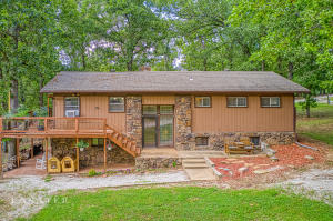 Here's the property you've been looking for! Privacy in this BEAUTIFUL outdoor setting yet close to town! All on pavement! 4.01 (m/l) acres with mature shade trees, this 5 bedroom 3 bath split level home has so much to offer! Tucked perfectly between beautiful shade trees providing a serene setting. Beautiful rock fireplace, open floor plan walkout decks..and did I mention wildlife? Nice 25X30 shop is complete with concrete floor and power. Basement is perfect for your large family or guest with the walkout deck and patio! The Hot tub stays with the home! This is your country home close to town!