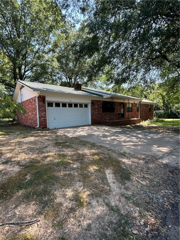Charming 3 bedroom, 2 bath home with 1,566 sq ft of living space tucked at the end of a quiet street in Ozark. Step inside to find warm plank flooring, a freshly updated bathroom with a new bathtub, and plenty of natural light throughout. The metal roof offers peace of mind, while the 1-car attached garage and 2-car detached garage provide great space for vehicles, storage, or a workshop. Enjoy the convenience of being inside city limits while still feeling tucked away. This move-in ready home is waiting for you!