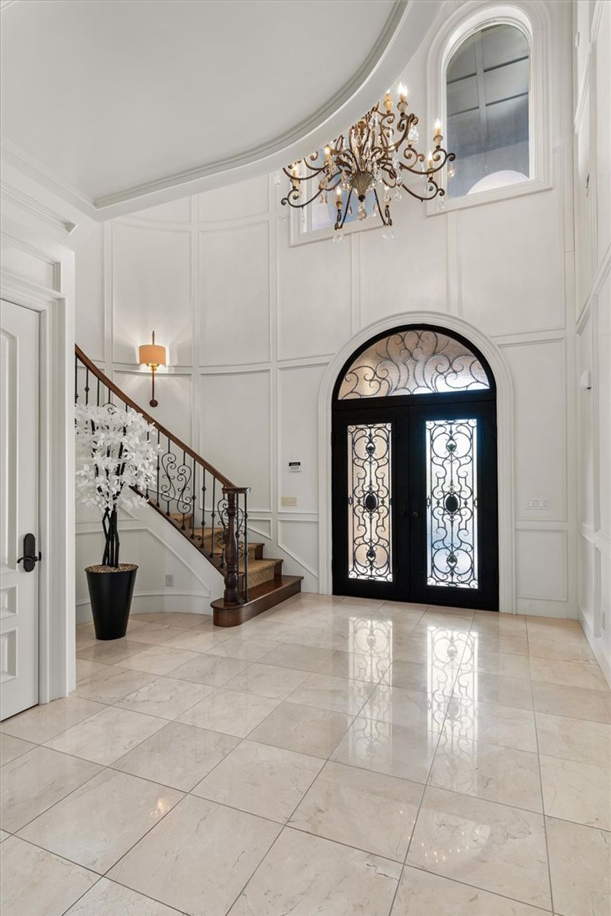 Located in the prestigious gated community of St. Valery Downs, this exceptional custom estate offers privacy, security, and unbeatable convenience—centrally positioned in the heart of Northwest Arkansas. This two-story residence blends luxury and functionality with high-end upgrades and built-ins throughout. Featuring new roof and windows (2025) and situated on 1.1 acres, the home includes a FEMA-compliant tornado safe room on the main level. Enjoy an expansive open-concept living, kitchen, and breakfast area anchored by a statement fireplace, plus a dedicated gym, private office and two laundry rooms. The gourmet kitchen boasts a built-in range, double ovens, steam oven, microwave, ice maker, refrigerator, and espresso machine. Enjoy resort-style outdoor living with a heated saltwater pool, outdoor kitchen, fire pit and multiple patios to complete this Bentonville oasis.