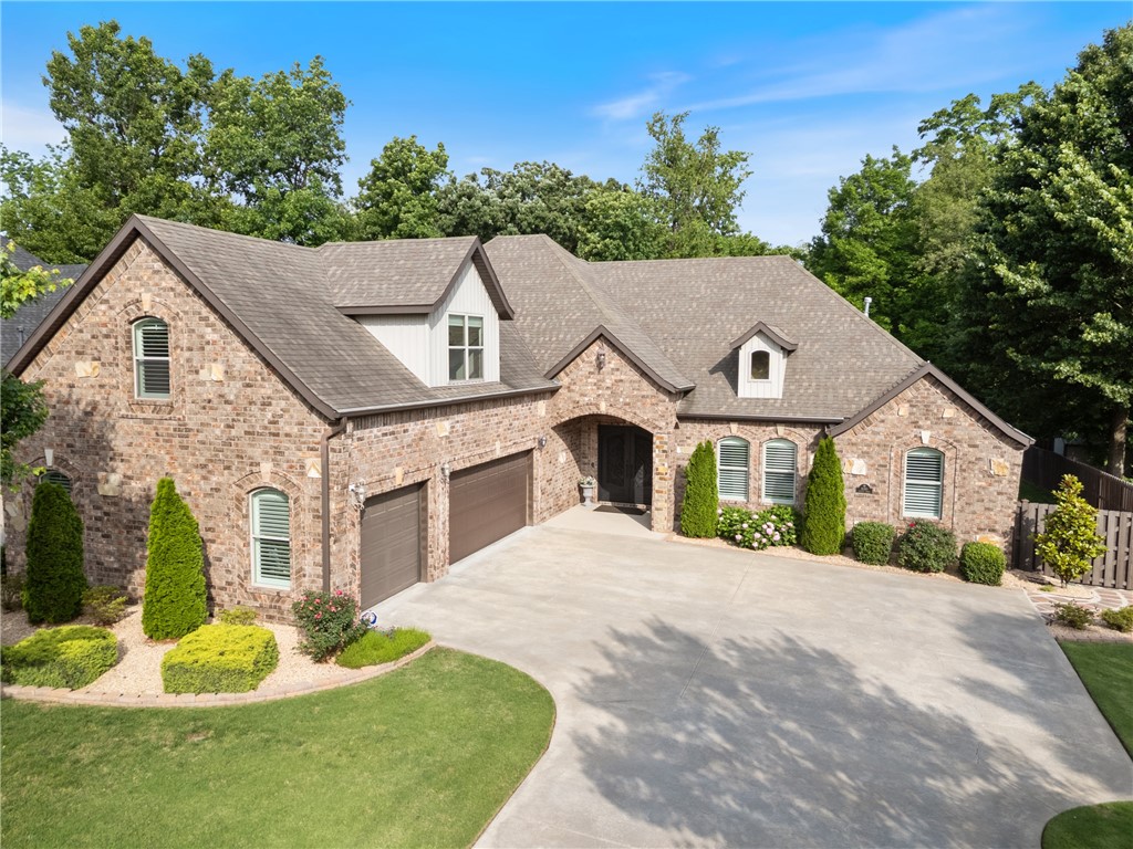 Conveniently located, crafted with care, and loaded with quality upgrades, this 4-bed, 3 1/2bath Quail Ridge beauty backs to scenic Little Osage Creek. The custom iron double front doors set the tone, opening to rich hardwoods, fresh paint throughout and designer lighting. Enjoy hand-selected multi-head ceiling fans in the family room, primary suite, and porch. The kitchen and dining glow with upgraded fixtures, while new window treatments add elegance throughout. The three downstairs bedrooms all feature new laminate floors. New plush carpet graces the entire upper level with 4th bedroom, 3rd full bath, and expansive bonus room. The screened-in porch and new fencing overlook a professionally landscaped private yard and tranquil mature tree'd greenbelt. The oversized 3-car garage with insulated overhead doors offers exceptional storage throughout much like the rest of the home with ample storage around every corner. To top it off, washer/dryer, refrigerator make this home complete and convey with acceptable offer.