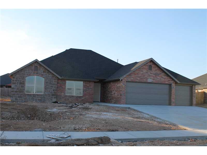 close to Wal-mart General offices. This home will be loaded with all the extras such as,privacy fence,full sodded lawn,full guttering,blinds,refrigerator,wood floors,fireplace,covered patio,3cm granite,custom cabinets,tile master,shower,fireplace,stainless steel appliances,walk in closets,whirlpool tub.