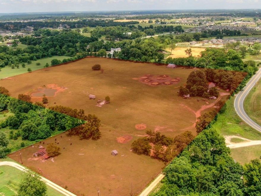 Developmental Potential! 29.36 Acres off W Monroe in Lowell. 482’ Hwy 264 road frontage. Cleared and level land with pond. Parcels include #12-02489-000,12-02010-604,12-02488-000, value in land and location. Easy access to XNA Airport and I-49. Fast growing area and an ideal investment opportunity!