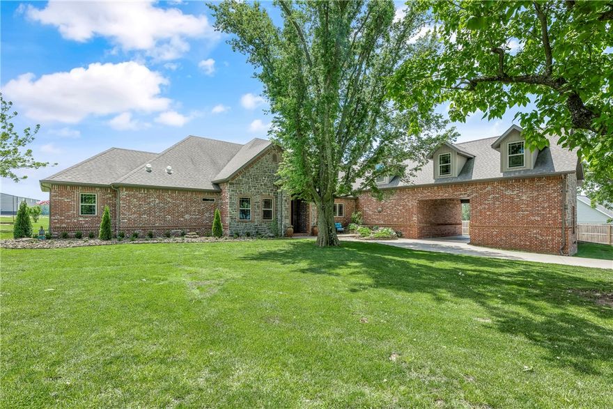 Immaculately crafted by its sole owners, this impressive estate boasts 5 bedrooms, 4 bathrooms, 2 living areas, and 3 car garage all situated on approximately 4+ acres with beautiful mature trees.  The heart of this home is the spacious gourmet kitchen featuring double ovens, gas cooktop, nugget ice machine, granite countertops, a large pantry and high-end cabinets with tons of extras.  The sizable primary suite has a luxurious ensuite bath with a large shower with 2 shower heads and elevated whirlpool tub, and an oversized walk-in closet. Big bonus room, separate bedroom, and full bath completes the upstairs. Outdoors you will find everything you need for entertaining.  The heated pool features a rock waterfall, tanning ledge with bubblers, and built in table with stools. The covered patio includes a fireplace, grilling area, and hot tub. Fun in the yard includes custom stamped concrete firepit, horseshoe pits, disk golf course, 2 hammocks and pond with dock.  The 40 x 60 shop is ideal for RV storage and hobbies.