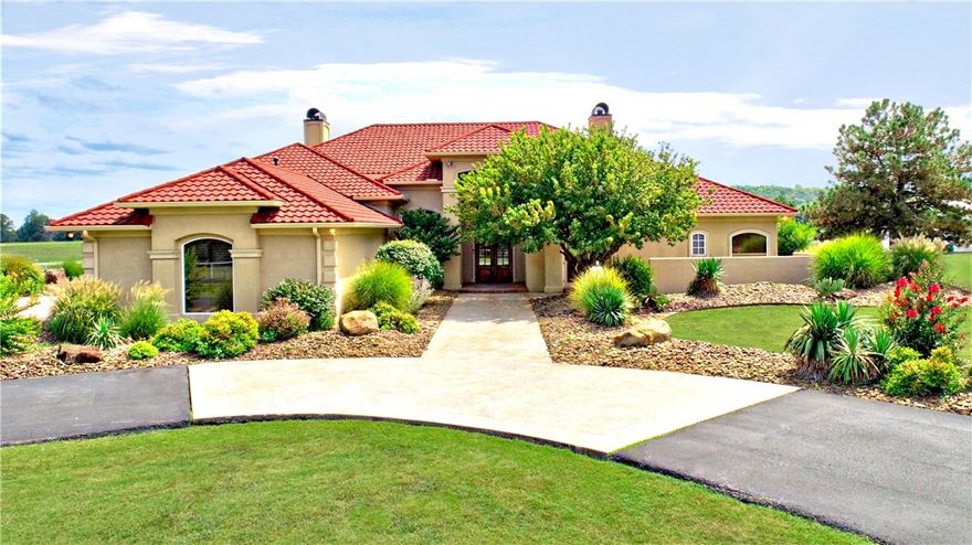Beautiful four bed, three and a half bath, old world mediteranean- style estate in East Springdale with shop/barn that has one full bathroom.  One level home with acreage plus office, sunroom, three car garage and two living areas. Barn is over 1700 square feet and includes an additional full bathroom, rv hook up, covered rv parking, two horse stalls, tact room/hay storage, newly added covered front porch with cedar beam accents, additional frost free water taps for animal life and plenty of room to grow.  2x2 Travertine flooring thoughout, limestone pillars and fireplace, mahogany and antique doors, extensive crown molding, custom wood features,  two gas fireplaces including a KIVA adobe surround in the iving area. Cedar lined closet next to office, ample storage, wide hallways, patures are fenced with iron and cable fencing, there is a cattleguard at entrace to the property, entrance off monitor is shared.