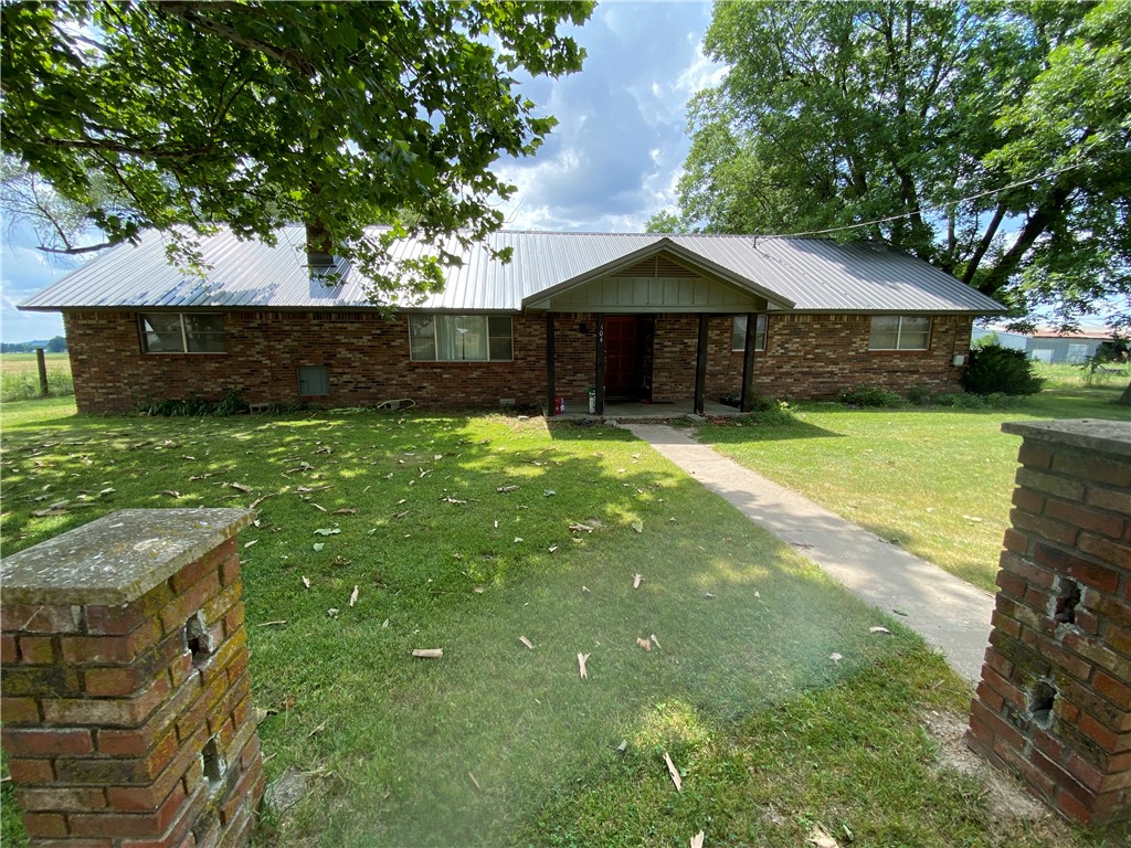 Ranch style house located on the South part of the property. Tenant occupied at $1,000 mo. Fantastic development opportunity in Lowell. 40 acres that is open and has almost 2,300 feet of paved road frontage. Would be great for residential or warehouse / mini storage development.