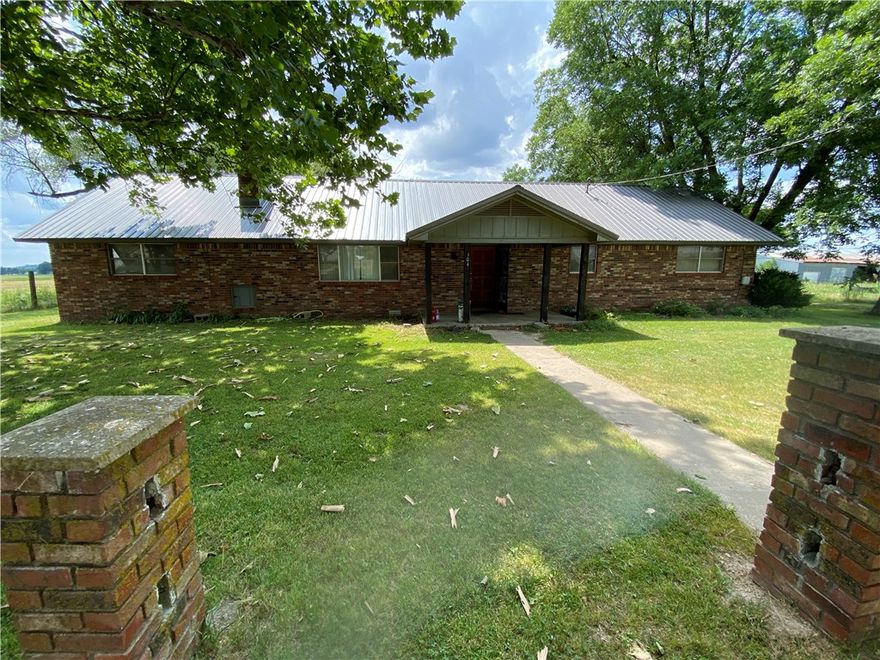 Ranch style house located on the South part of the property. Tenant occupied at $1,000 mo. Fantastic development opportunity in Lowell. 40 acres that is open  and has almost 2,300 feet of paved road frontage. Would be great for residential or warehouse / mini storage development.