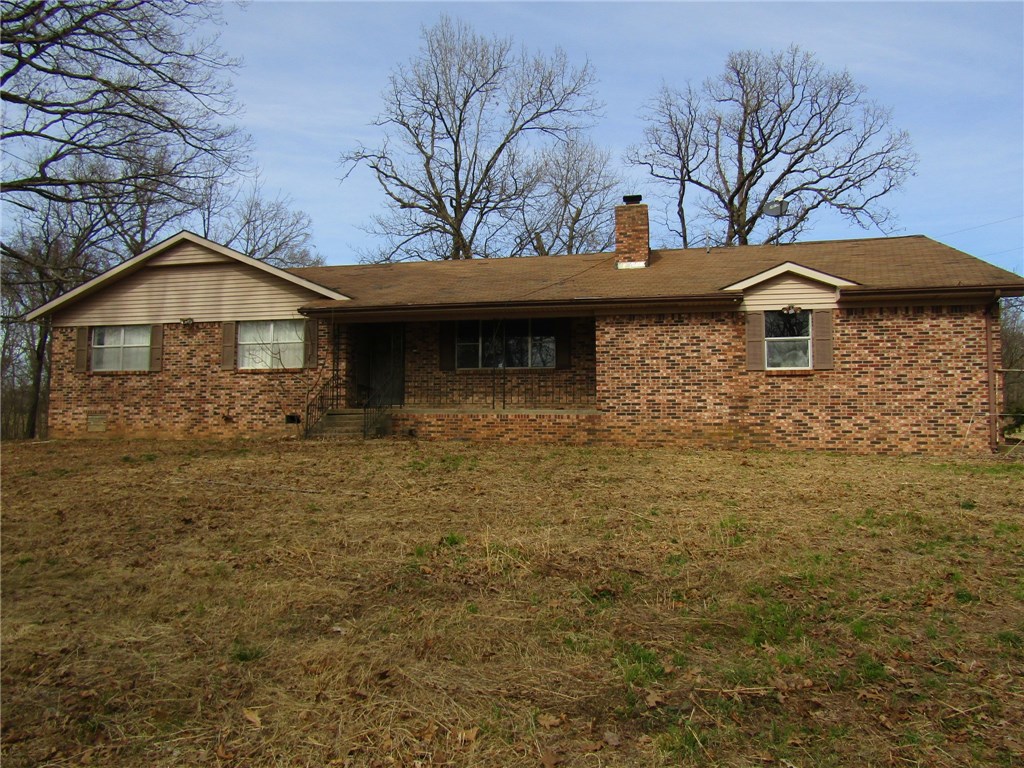 Just under 10 Acres with Large Barn AND Shop along with 3 Bedroom Home - located out of town between Pea Ridge and Garfield. Land is partially open(approx. 6A) and partially wooded(approx. 4A). Potential abounds. Property is being Sold As-Is, Cash only offers. Verification of funds and earnest money required with all offers.