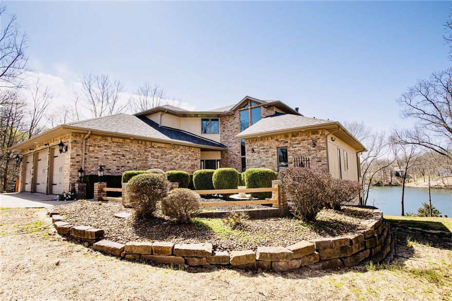 This is a special property finishing up nearly a complete renovation. Your new home is filled with peaceful energy, style, fun, and privacy, is nestled in a nature loving setting. Located on the desirable East side of Bella Vista, close to everything, including downtown Bentonville and top rated schools, this modern contemporary lakefront and wide lakeview home defines itself as living on vacation every day, and regardless of weather, or state of affairs, you will have an incredible amount of space to just roam free. Live surrounded by common and open wooded areas and trails that just let you be you and let your kids be kids again. This home has a stroll in beachfront, and also sports a drop in to the back 40 for mountain biking and hiking, and you’re just a few pedals away from hoping on the new paved greenway link by Metfield Pool and Dogwood Golf Courses. Inside entertainment features your home theater, gaming room disco, bar, home gym, and billiard table. Need a mother in law suite? We’ve got that too!