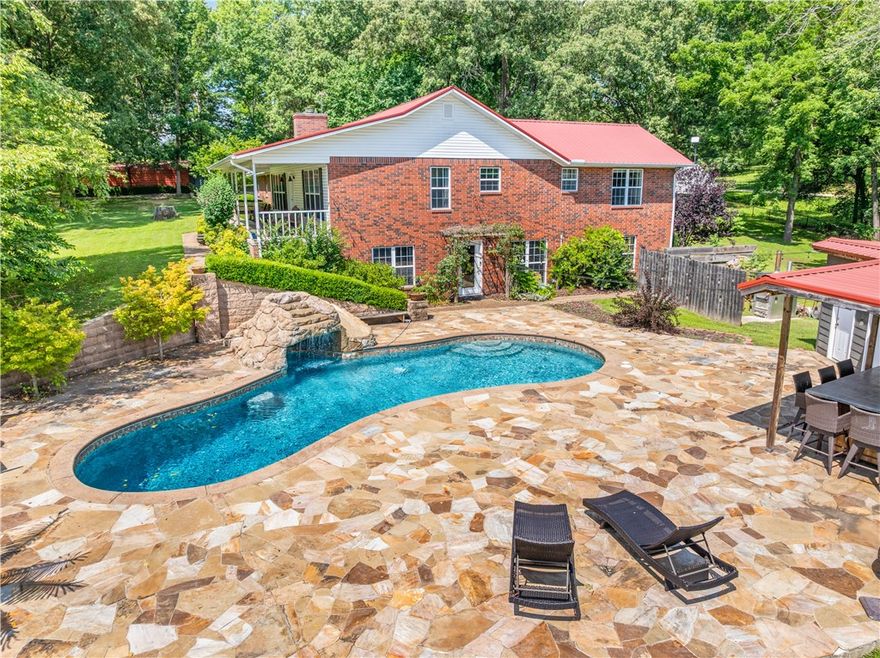 4 BR, 3 BA Country Oasis in Harrison - nearly 80 acres meet 3/4 mile of frontage along Crooked Creek. Enjoy fishing, canoeing, swimming, camping, picnicking, or ATV riding. Enjoy days in the inground pool w/a waterfall, slide & outdoor bathroom. The property also has a natural spring, koi pond & a gazebo perfect for fireside gatherings. Inside are maple hardwood floors. The kitchen has concrete counters, ample cabinetry & access to the deck. The living room has a wood-burning fireplace w/a custom mantel sourced from the property itself & an office nook. Master suite has 3 closets, double sinks, clawfoot tub & a walk-in tile shower. Downstairs, there are 2 bedrooms, a full kitchen, a built-in bar, media room & heated tile floors in the bathroom. A non-conforming bedroom adds to the space. The 2-car garage has a pull-down attic. 5-stall horse barn w/attached shop, chicken barn & goat area along with hay-producing fields. This is an opportunity to own a blend of outdoor adventure & agricultural potential.