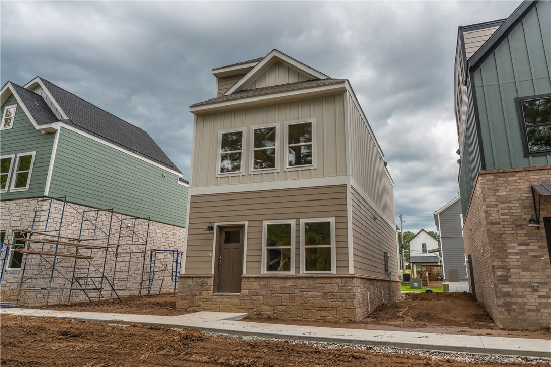 Brand new 2 BR/2 BA townhomes in south Fayetteville located close to U of A, Baum-Walker Stadium, The Ramble, Razorback Greenway, I-49, and all of Fayetteville's downtown area. This beautiful home features luxury vinyl plank throughout. The primary bedroom, kitchen and living area are on second level with the second bedroom and utility room on the first level. Kitchen has a pantry and both bedrooms have walk-in closets. Tub/shower combos in both baths. Third floor loft provides flex space. 2 car garage. Agent owned.