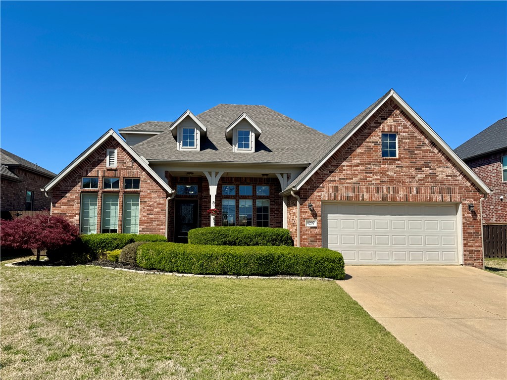 Beautiful home with versatile floor plan! Oversized kitchen that is open to the family room, granite countertops, all new appliances, and eat-in dining area. Lots of windows let in natural light that brighten the home. Primary bedroom has walk-in closet, large bathroom with dual vanities, walk-in shower, and whirlpool tub. Wood floors throughout downstairs. Bedrooms 2 & 3 are downstairs with full bathroom. Upstairs has huge bonus room with full bathroom. One of the biggest fenced yard in the subdivision with new fence and stain and your private inground salt water pool that is fenced off. Security system and irrigation included. Storm shelter in garage. New roof. Conveniently located subdivision featuring community pool and playground. Close to Sam's Club and NWACC.