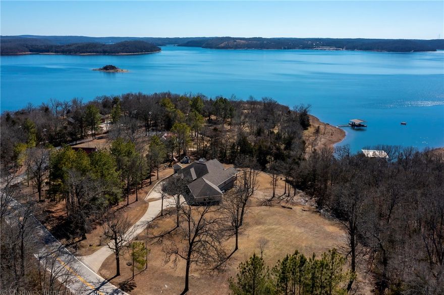 SPECTACULAR. Gentle Walk to the Lake. Boat Dock with boat lift, jet ski lift, and swim deck completely redone. Full home generator.  Has a oversized 3 car garage with a Tesla charger. 2 Master Suites, and two large living areas. Finished full walkout basement with lots of natural light. Concrete basement walls with a safe room closet in the basement, Wet Bar, and 4 large bedrooms. A ONCE IN A LIFETIME OPPORTUNITY TO OWN THIS PIECE OF PARADISE!