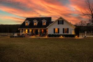 Peaceful 10-Acre Retreat with Pool & Workshop. This spacious 3,300 sq. ft. two-story home offers 4 bedrooms, 3.5 baths, and abundant storage in a serene country setting. The upgraded kitchen features granite countertops, a walk-in pantry, and a new picture window. A cozy sitting room boasts built-ins and a wood-burning fireplace with a ducted blower. The primary suite includes a walk-in tiled shower, antique clawfoot tub, and walk-in closet. Two bedrooms share a Jack-and-Jill bath, while upstairs features a large family room, guest suite, and oversized storage room. Outside, enjoy a workshop, lean-to, chicken pen, fenced pastures, and three garden areas. Relax by the in-ground pool, with a new liner, pump, and cover. Recent upgrades: new windows along the south side & a culvert drain.