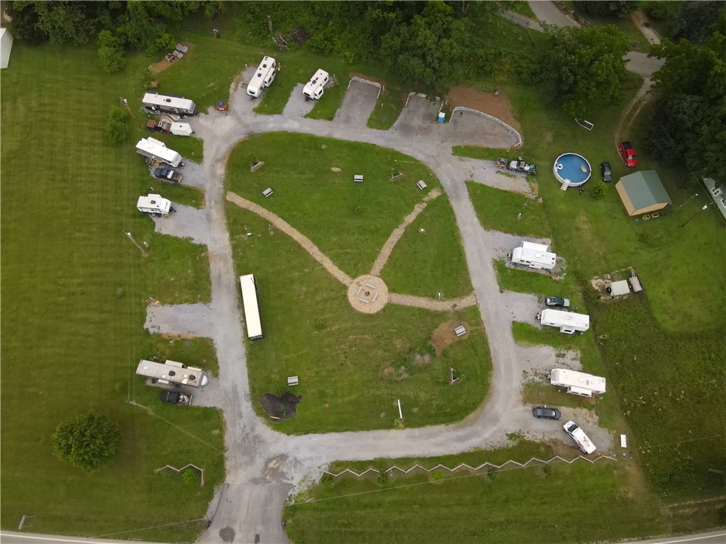 Now available—The Freakin’ Frog Campground, a small RV park located near Gentry and Siloam Springs. This park offers a great opportunity for an investor or owner/operator looking to step into an established business with consistent, long-term tenants.
The property features 15 full-hookup RV sites, a gravel loop drive, open green space, and a private, quiet atmosphere that appeals to long-term guests. The campground is currently operating with many month-to-month renters, providing steady cash flow.
Included on the property is an unfinished office structure ready for customization to suit your operational needs. The park also utilizes an online reservation and payment system for easy guest management.
This is a great option for a hands-on owner ready to continue developing a unique, income-producing property with a fun and memorable brand.
Guest records and business assets may convey with acceptable offer. Financials available to qualified buyers upon request.
