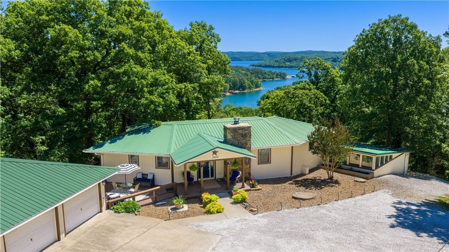 Your Beaver Lake home awaits!  Your boat has a slip in the community dock & your home offers 4400  sq ft of living space including an enclosed heated  swimming pool for year round fun. Relax on the upper or lower deck & take in the fabulous lake view.  Updates include a new kitchen, primary suite & bath, and a huge patio  for gatherings with family and friends.   Situated on 7.34 acres ( divided into lots for possible future expansion ) providing the luxury of peaceful privacy. The  lower level with 2 bedrooms each with its own bath, a huge living area with seating, dining, & kitchen areas is perfect for large gatherings. The adjoining sunroom with hot tub will provide year round relaxation and fun. Enhanced with newly painted interiors, rich new LVP flooring, and wonderful light filled rooms, you will love this updated home. Geothermal  heating and cooling  keeps your home comfortable  for every season. You have covered parking with water and electric hookups for your RV. Life is good at Wills Court!