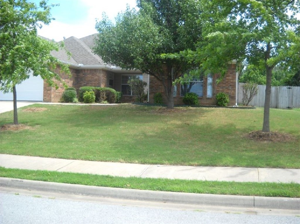 Four bedrooms and 2 full baths. Located conveniently near the I-49 bypass with only a short distance to the NWArk Mall, offices, shopping & dining. Faux-wood floor in big open living room, gas-logs fireplace, ceiling fans and blinds throughout. Split floor plan, crown molding and neutral paint throughout. Double closets and step-in shower in master bedroom. Covered front porch, back patio, fenced yard, double enclosed garage.