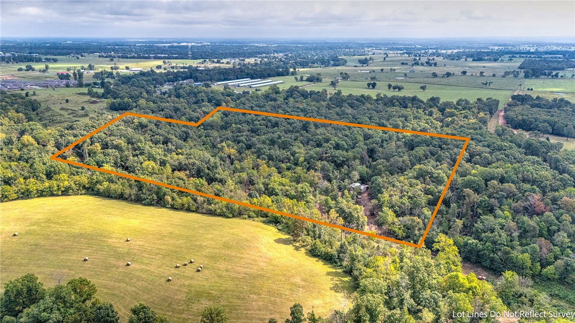 Prime Investment Opportunity – Nearly 20 Acres in Highfill/Gentry, AR! Located less than half a mile from the rapidly growing town of Highfill and just 3 miles from Northwest Arkansas National Airport, this property offers outstanding potential for development, income, pasture, timber, or long-term investment. A natural spring and creek run through the land, electric is already on-site, and water is available at the street—making this a rare find in a high-growth area. Shop on the property with no value given.