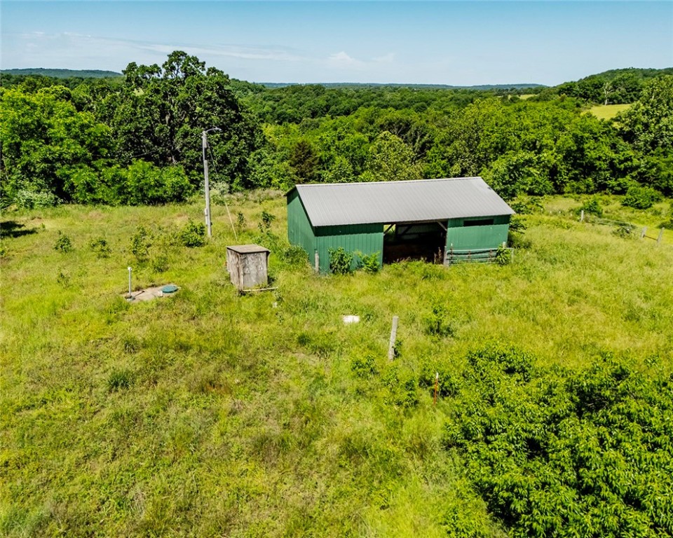 Exceptional opportunity to own 39.82 Acres +/- close to Prairie Grove and only 4 miles to the I-49 corridor. This beautiful gently rolling, partially wooded land is completely fenced with 2 ponds and a
24 X 36 pole barn. The abundant water well and electricity on site, makes it convenient for building your dream home with views, on one of the several available sites. This land is also versatile and can be used for cattle farming (property is currently leased for cattle), recreational use or escaping the city life. Schedule your showing to see this exceptional property today! Also, see MLS# 1309008