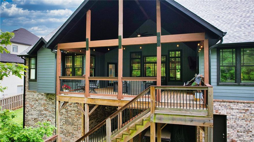 New Price — $50,000 reduction! Motivated sellers invite buyers to experience exceptional value in Centerton’s gated Oak Tree community. This elegant 5-bed, 4-bath home offers a thoughtful floor plan with tall ceilings, hardwoods, and abundant natural light. The chef’s kitchen features a large island, quartz countertops, double ovens, and walk-in pantry, flowing into the open living and dining areas with custom fireplace, built-ins, and a hidden 14×7 storage room. Two bedrooms on the main level including a luxurious primary suite with spa bath and dual closets, plus a dedicated office. Upstairs provides three bedrooms and two spacious bonus/flex rooms. Enjoy the expansive covered deck overlooking a private, wooded, fully fenced backyard with professional landscaping. Oversized tandem 3-car garage. Community amenities include clubhouse, pool, playground, tennis, pickleball, and basketball. A rare value opportunity in Oak Tree—schedule your visit today.